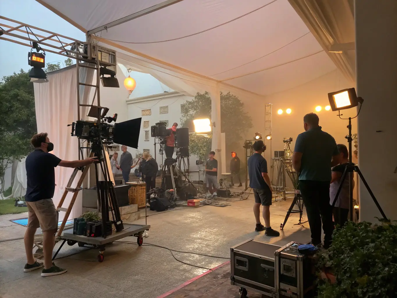 A behind-the-scenes shot of a film crew working on a set, with cameras and lighting equipment in action, highlighting the collaborative nature of our film production projects.